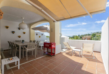 Beautiful south-facing, four bedroom townhouse in Los Almendros, part of the secure Los Arqueros Golf community in Benahavís
