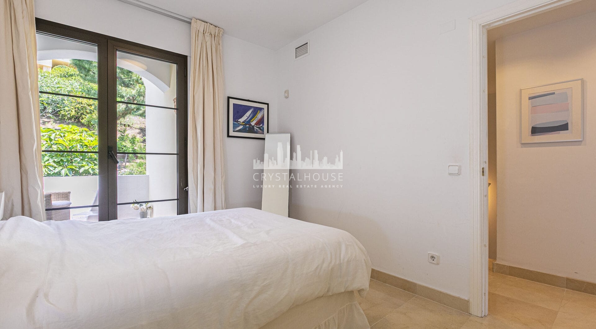 Beautiful south-facing, four bedroom townhouse in Los Almendros, part of the secure Los Arqueros Golf community in Benahavís