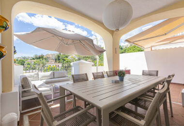 Beautiful south-facing, four bedroom townhouse in Los Almendros, part of the secure Los Arqueros Golf community in Benahavís