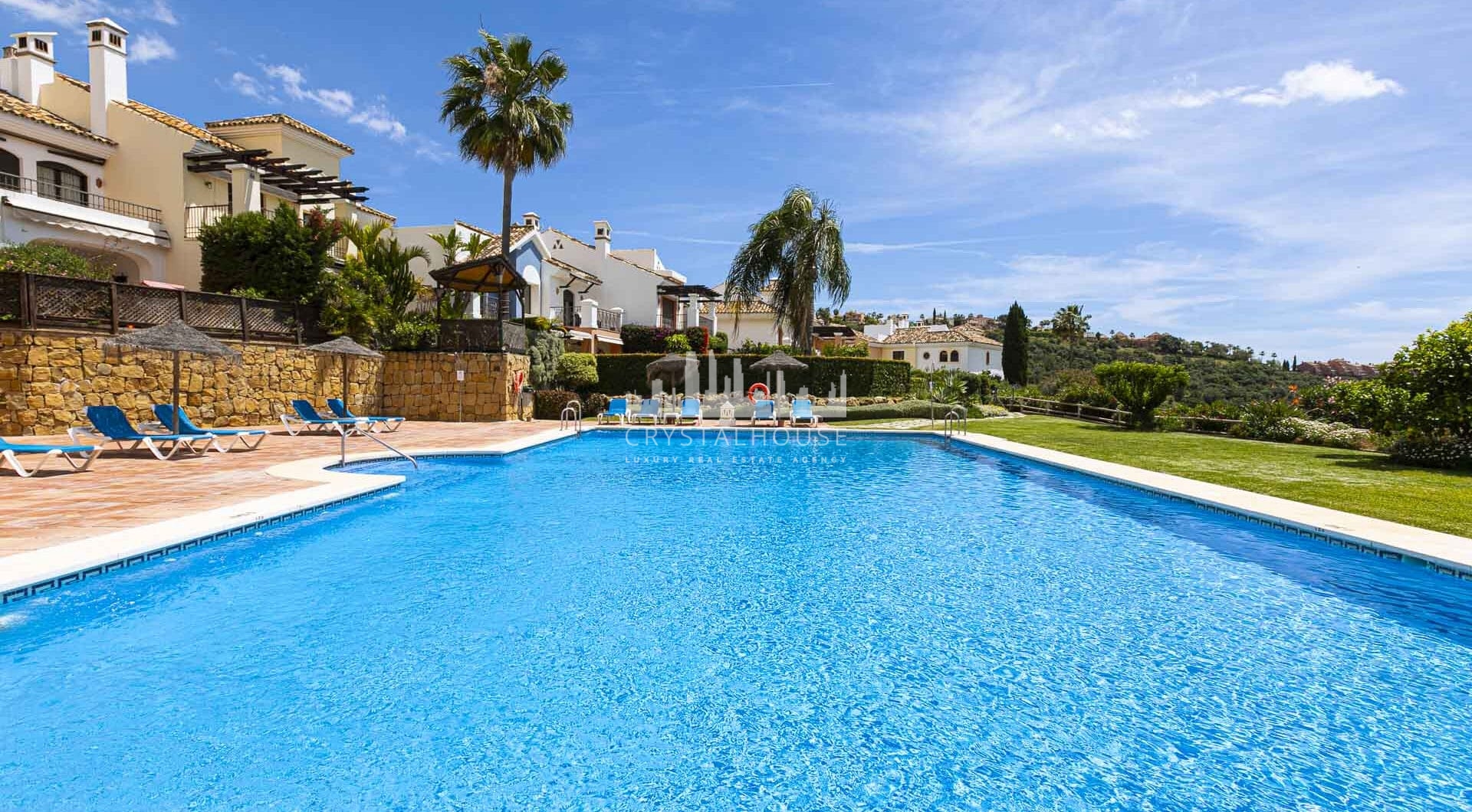 Beautiful south-facing, four bedroom townhouse in Los Almendros, part of the secure Los Arqueros Golf community in Benahavís