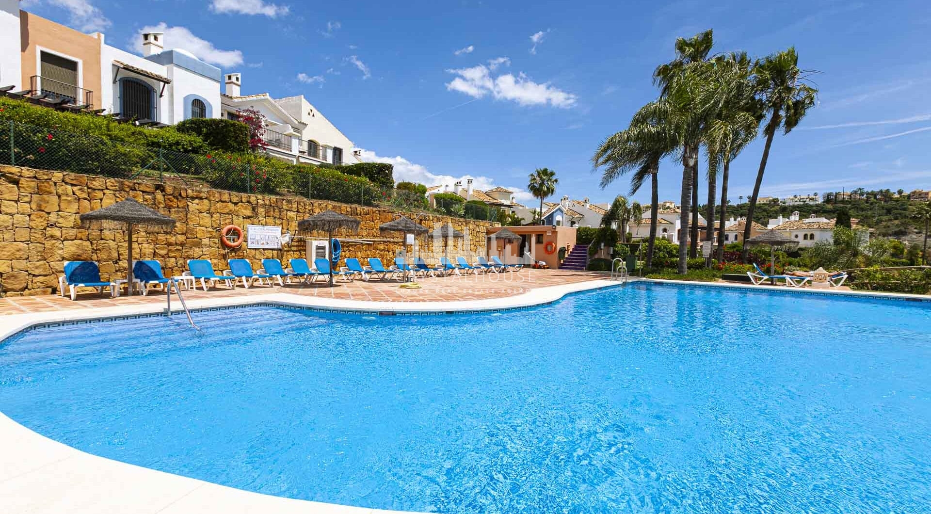 Beautiful south-facing, four bedroom townhouse in Los Almendros, part of the secure Los Arqueros Golf community in Benahavís