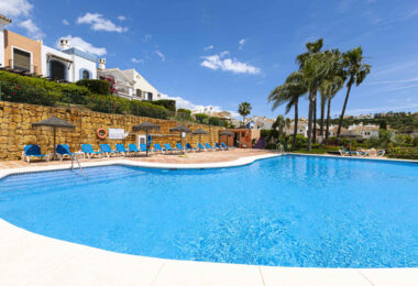 Beautiful south-facing, four bedroom townhouse in Los Almendros, part of the secure Los Arqueros Golf community in Benahavís