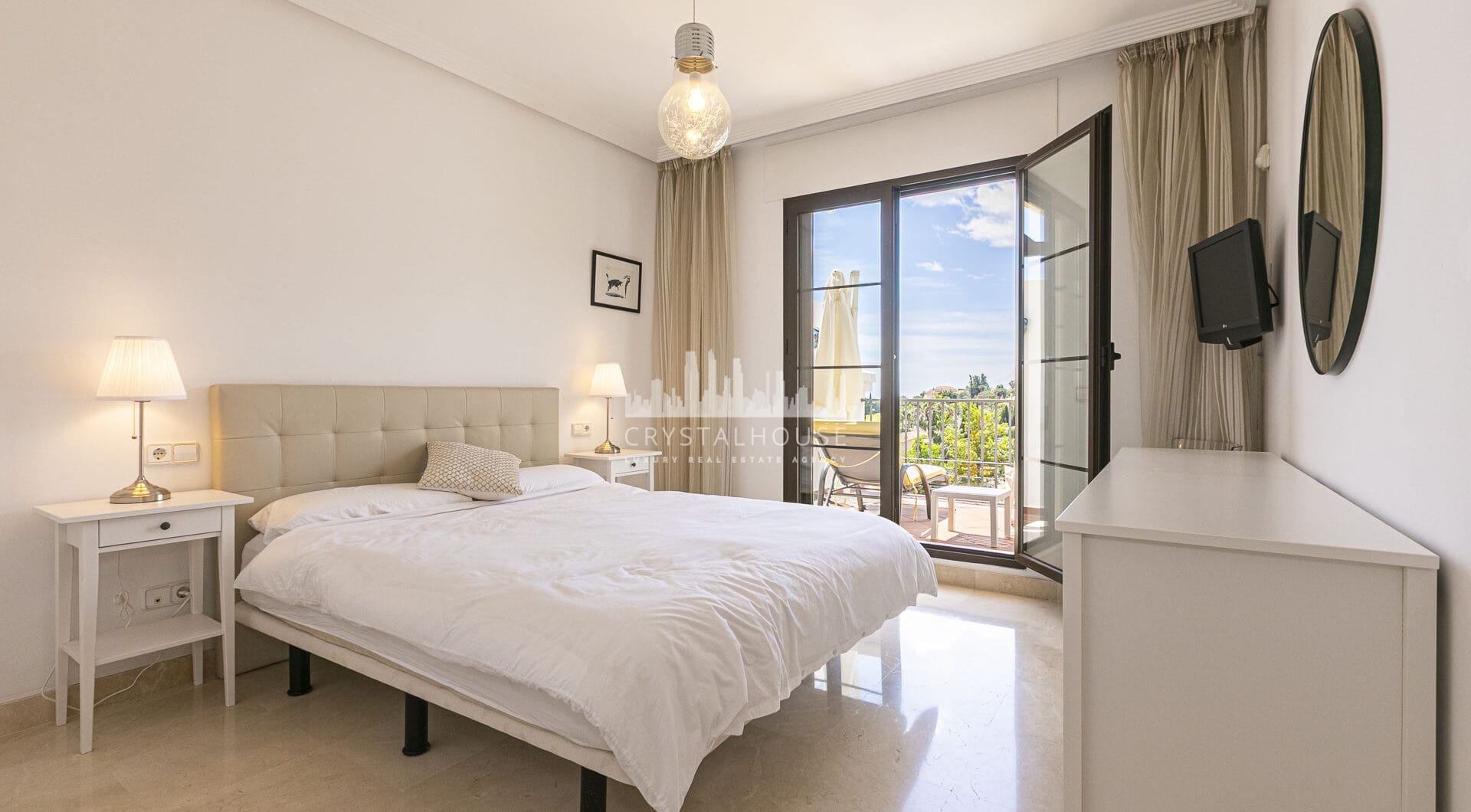 Beautiful south-facing, four bedroom townhouse in Los Almendros, part of the secure Los Arqueros Golf community in Benahavís