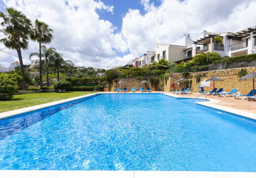 Beautiful south-facing, four bedroom townhouse in Los Almendros, part of the secure Los Arqueros Golf community in Benahavís