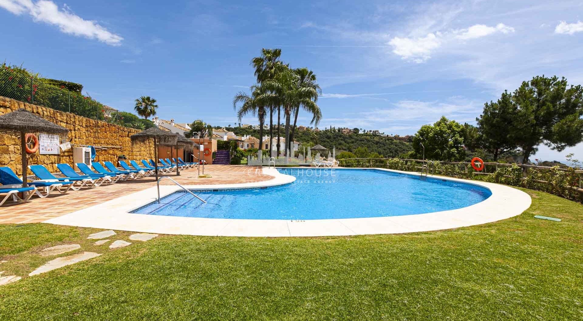 Beautiful south-facing, four bedroom townhouse in Los Almendros, part of the secure Los Arqueros Golf community in Benahavís
