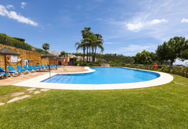 Beautiful south-facing, four bedroom townhouse in Los Almendros, part of the secure Los Arqueros Golf community in Benahavís