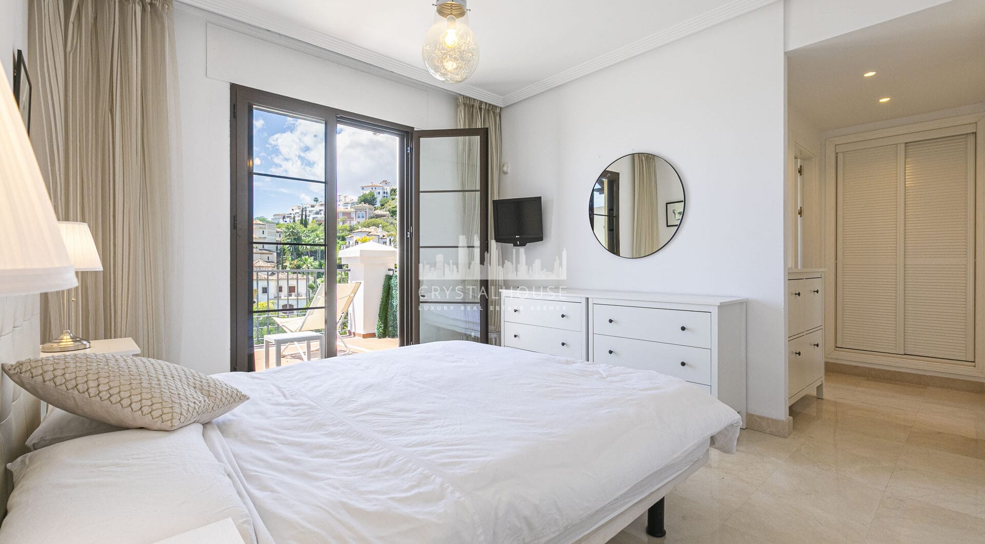Beautiful south-facing, four bedroom townhouse in Los Almendros, part of the secure Los Arqueros Golf community in Benahavís