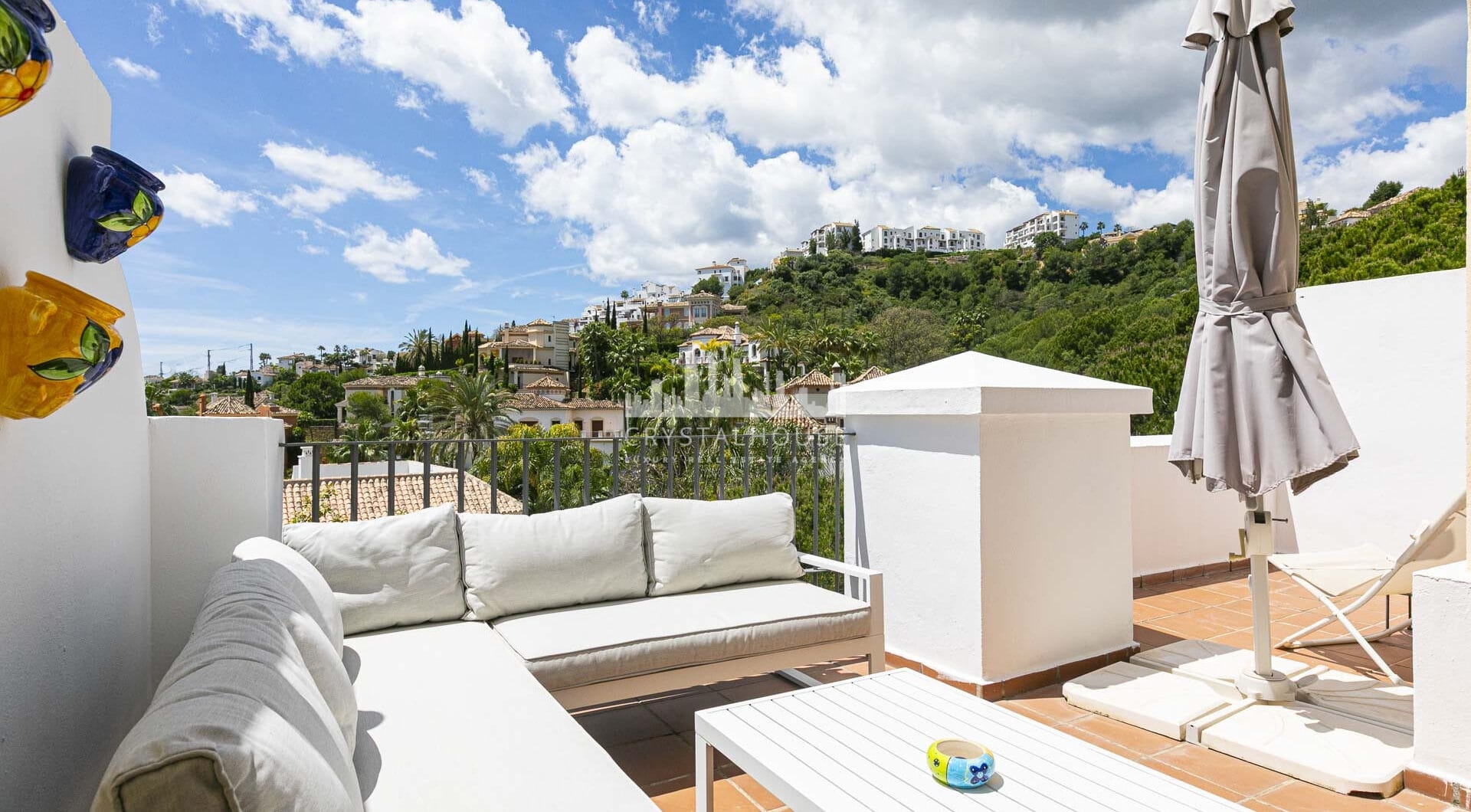 Beautiful south-facing, four bedroom townhouse in Los Almendros, part of the secure Los Arqueros Golf community in Benahavís