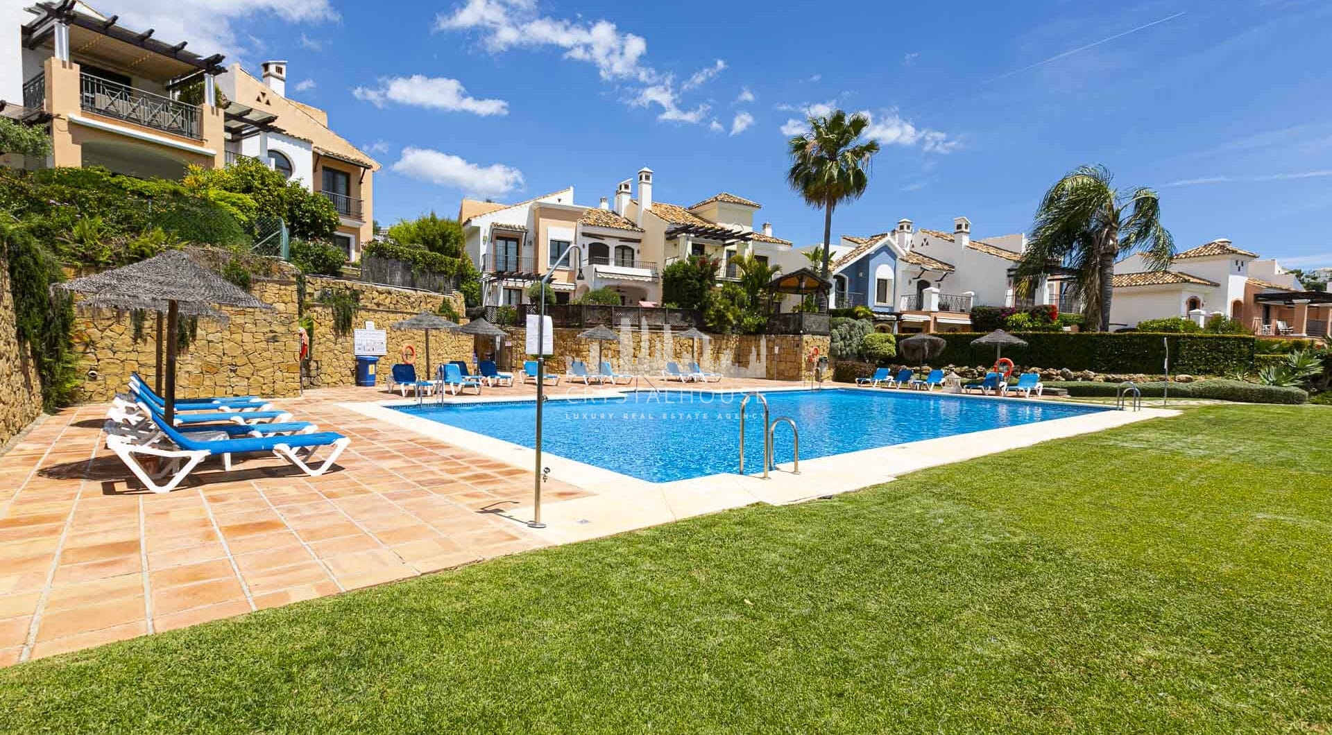 Beautiful south-facing, four bedroom townhouse in Los Almendros, part of the secure Los Arqueros Golf community in Benahavís
