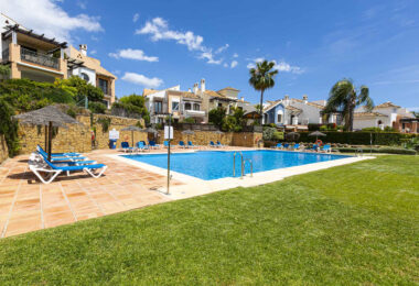 Beautiful south-facing, four bedroom townhouse in Los Almendros, part of the secure Los Arqueros Golf community in Benahavís