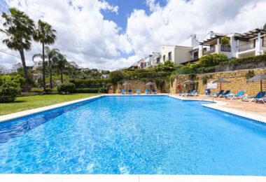 Beautiful south-facing, four bedroom townhouse in Los Almendros, part of the secure Los Arqueros Golf community in Benahavís