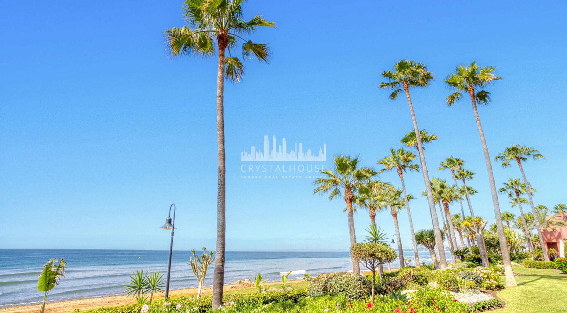 Impeccably renovated, south facing beach front, garden apartment located in the exclusive Menara Beach community on the sought-after New Golden Mile