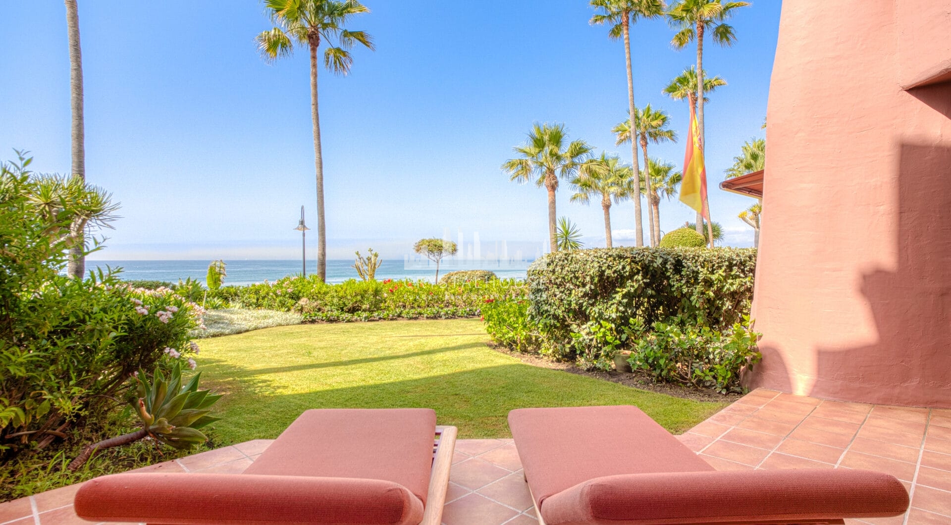 Impeccably renovated, south facing beach front, garden apartment located in the exclusive Menara Beach community on the sought-after New Golden Mile