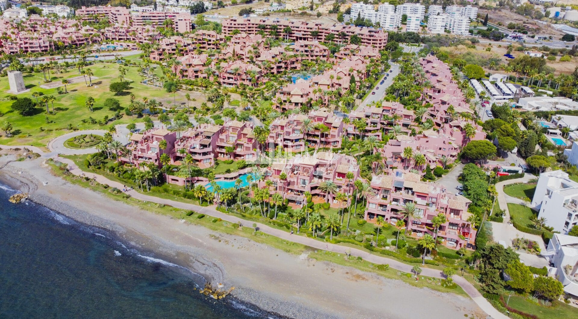 Impeccably renovated, south facing beach front, garden apartment located in the exclusive Menara Beach community on the sought-after New Golden Mile