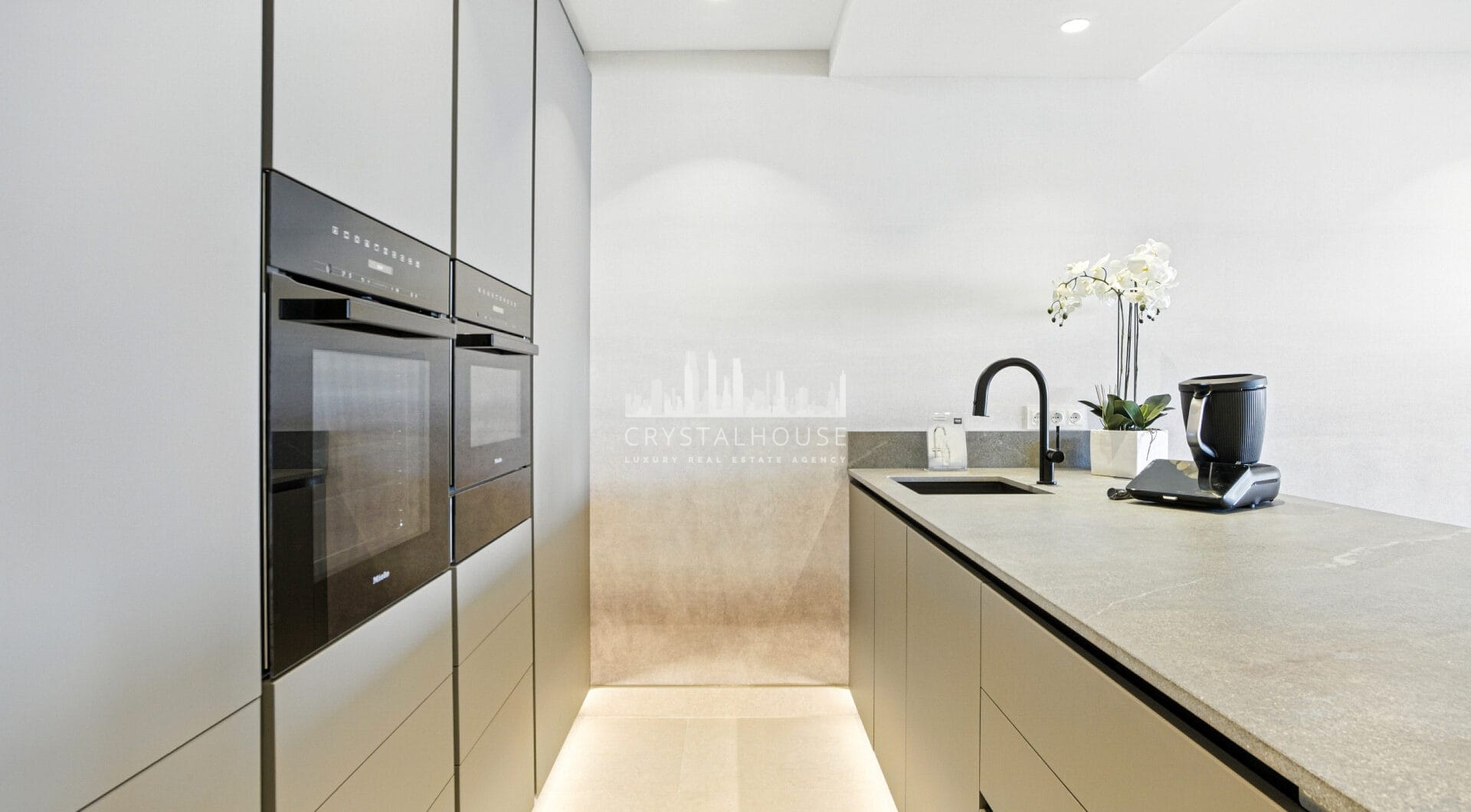 Impeccably renovated, south facing beach front, garden apartment located in the exclusive Menara Beach community on the sought-after New Golden Mile
