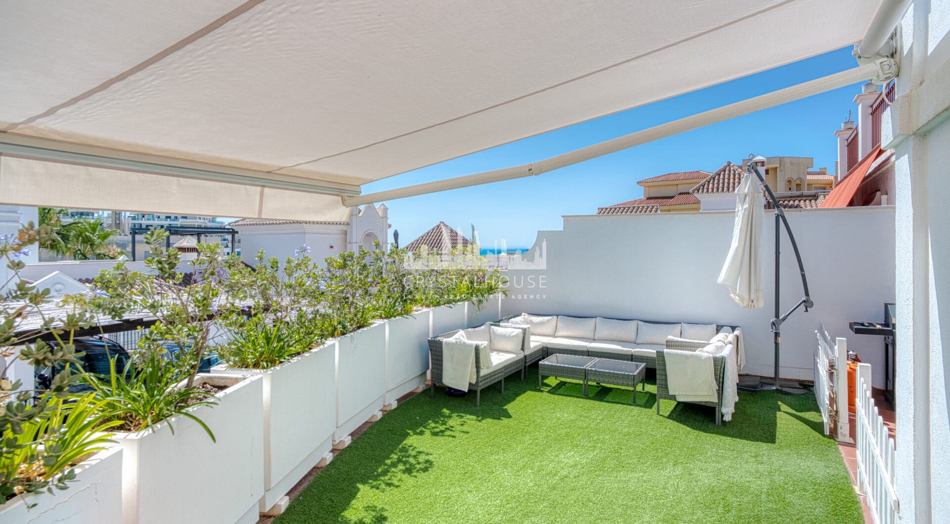 Stylish south west facing, three-bedroom semi detached townhouse located in Riviera del Sol