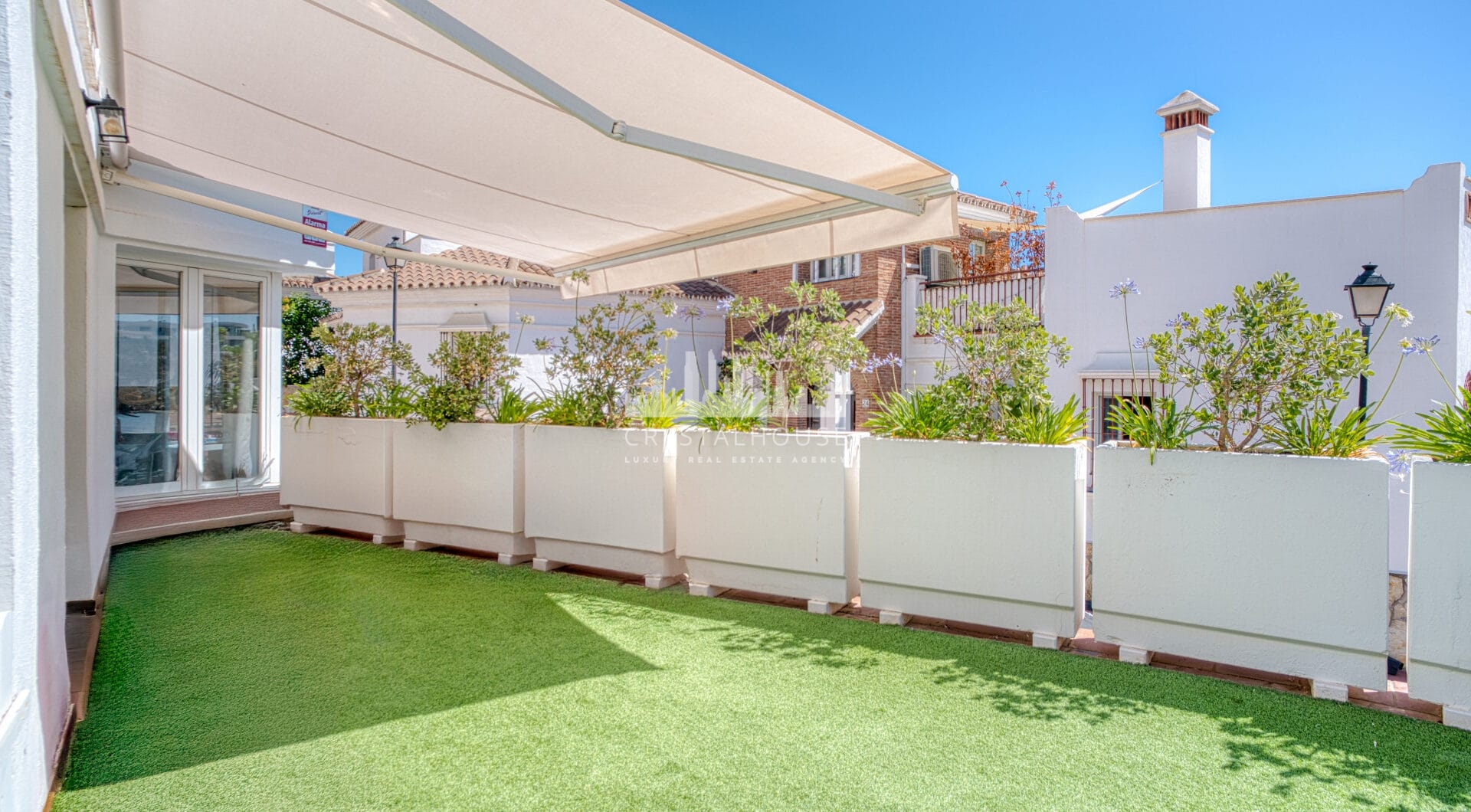 Stylish south west facing, three-bedroom semi detached townhouse located in Riviera del Sol