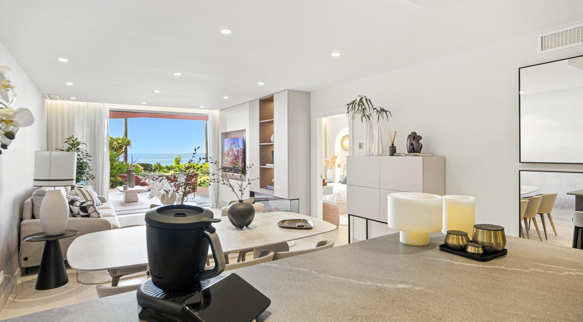 Impeccably renovated, south facing beach front, garden apartment located in the exclusive Menara Beach community on the sought-after New Golden Mile