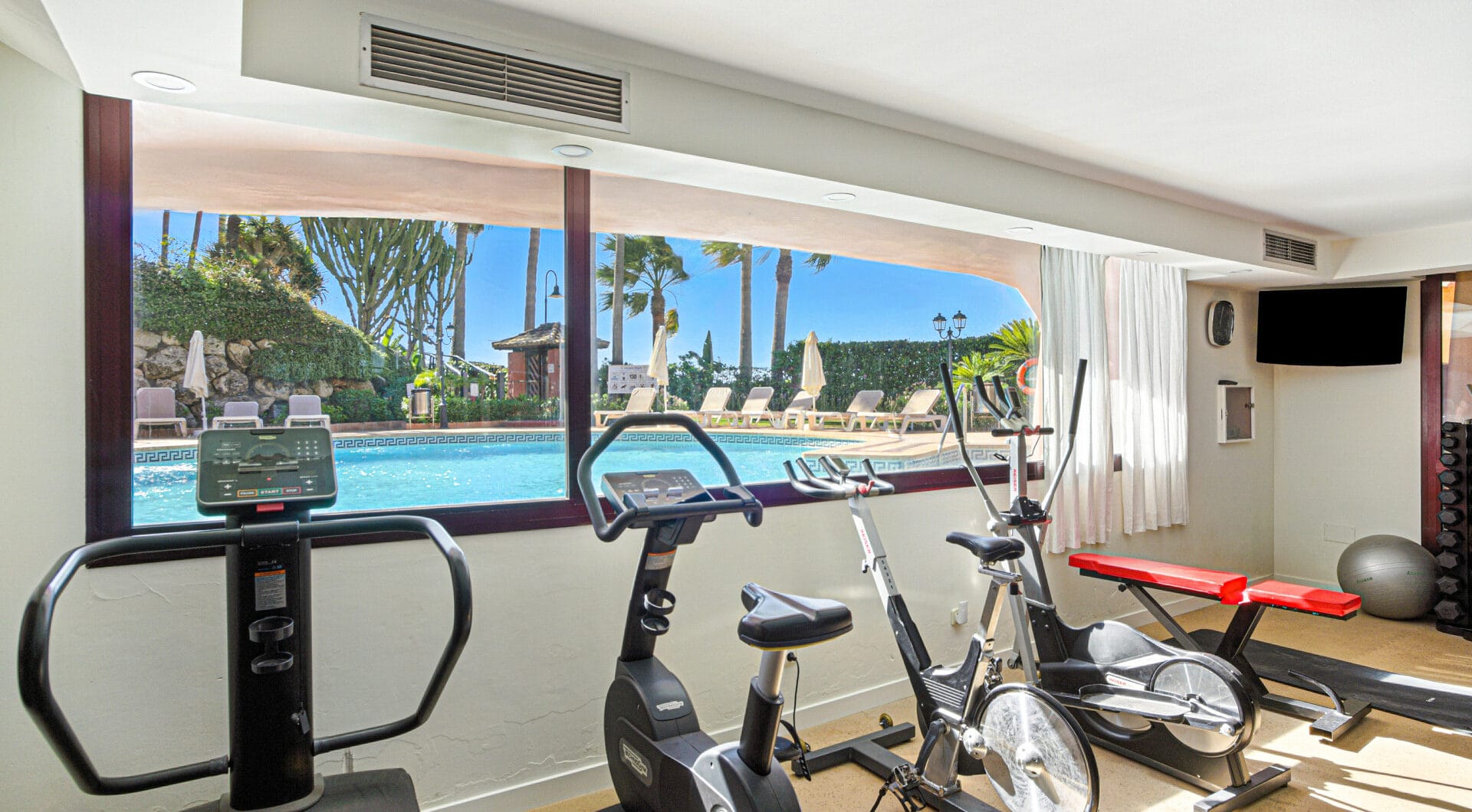 Impeccably renovated, south facing beach front, garden apartment located in the exclusive Menara Beach community on the sought-after New Golden Mile