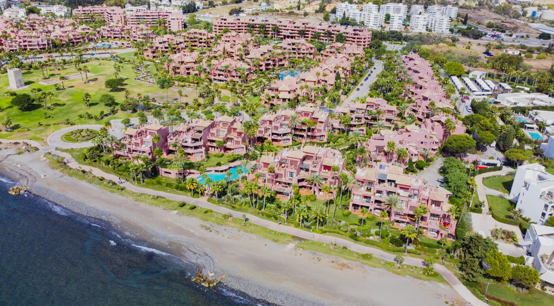 Impeccably renovated, south facing beach front, garden apartment located in the exclusive Menara Beach community on the sought-after New Golden Mile