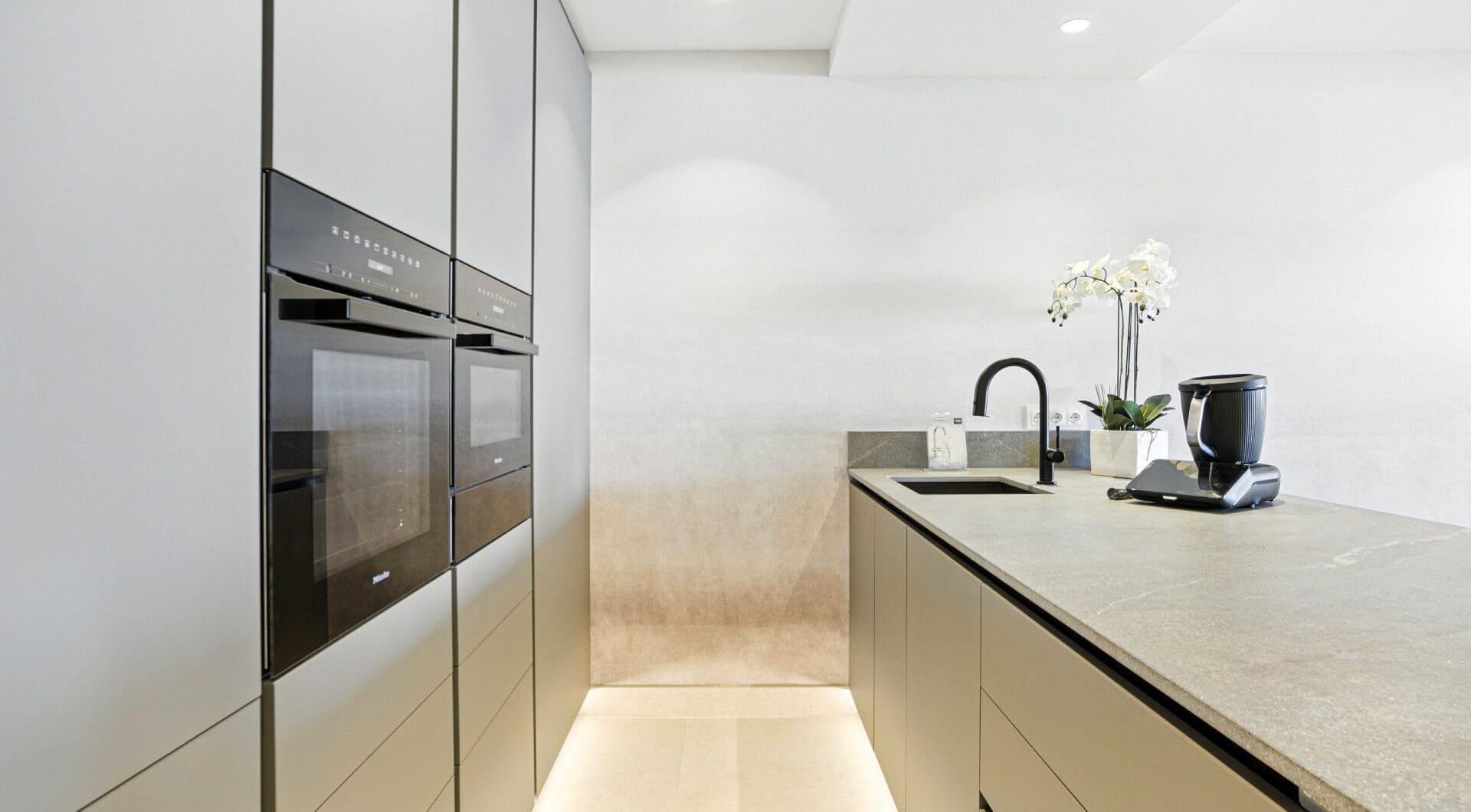 Impeccably renovated, south facing beach front, garden apartment located in the exclusive Menara Beach community on the sought-after New Golden Mile