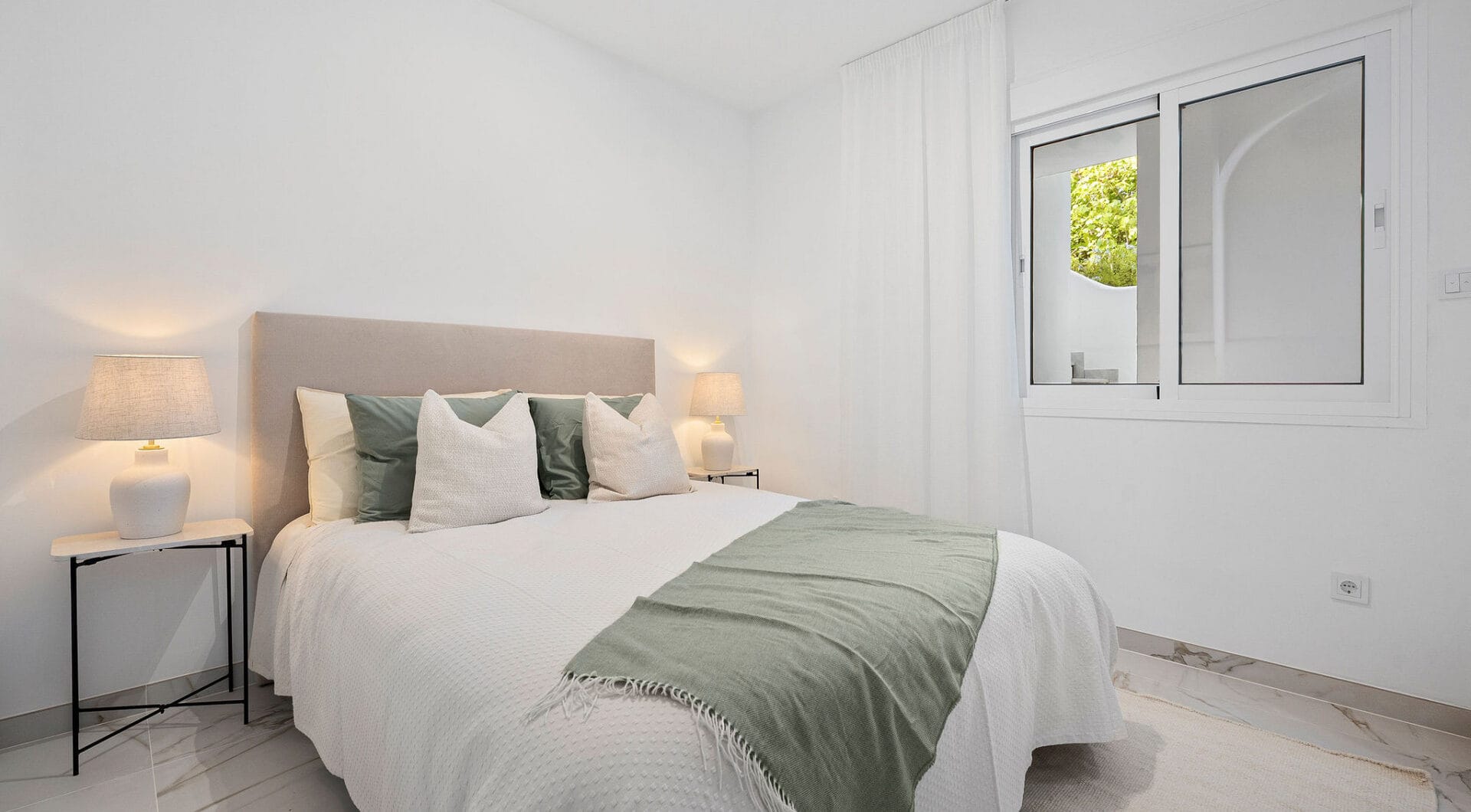 Welcome to this beautifully renovated ground floor apartment in Guadalmina Baja – Steps from the Beach and Golf!