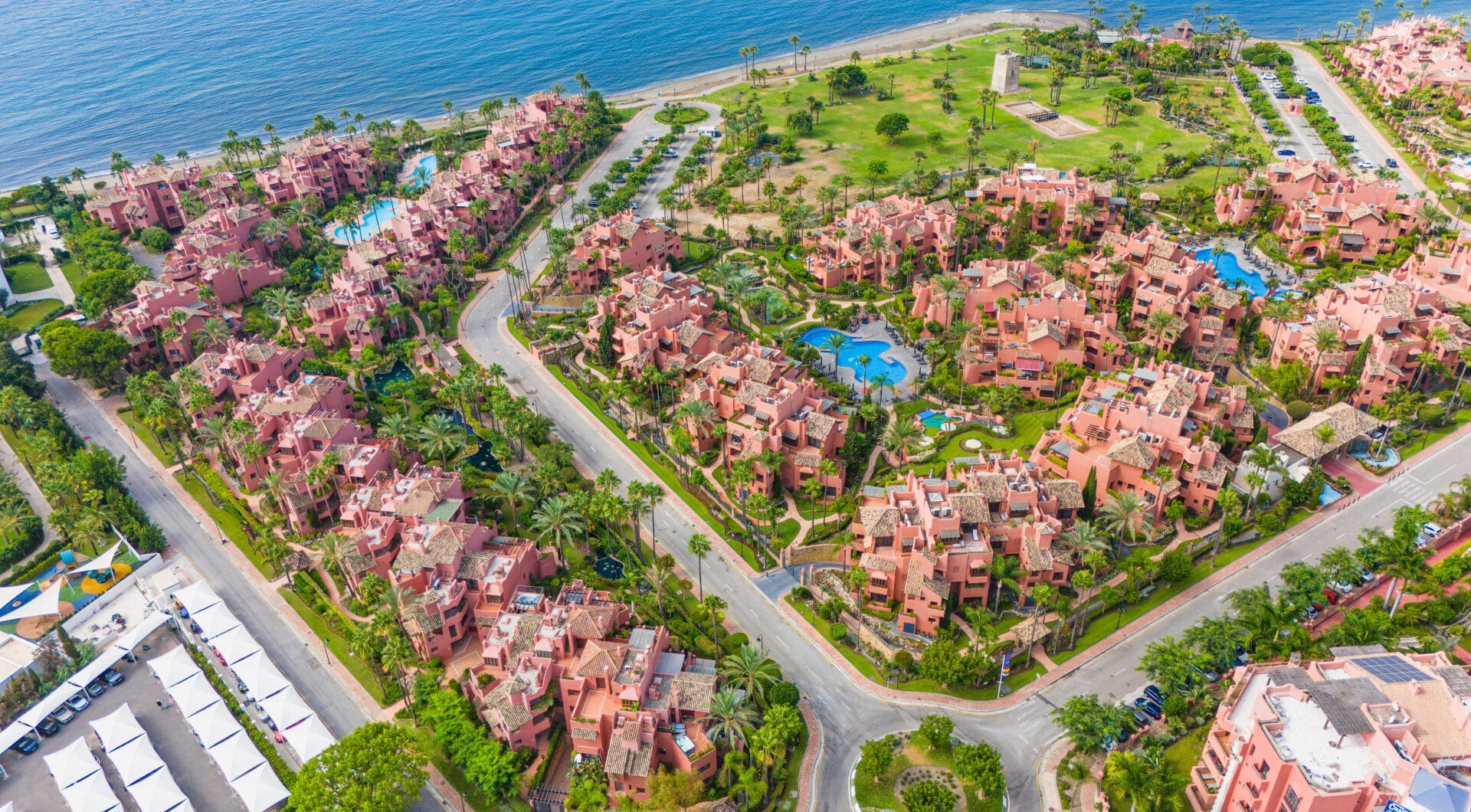 Impeccably renovated, south facing beach front, garden apartment located in the exclusive Menara Beach community on the sought-after New Golden Mile