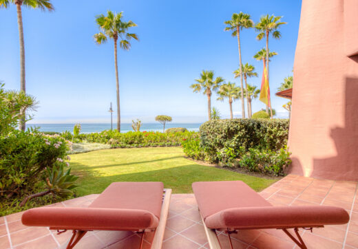 Impeccably renovated, south facing beach front, garden apartment located in the exclusive Menara Beach community on the sought-after New Golden Mile
