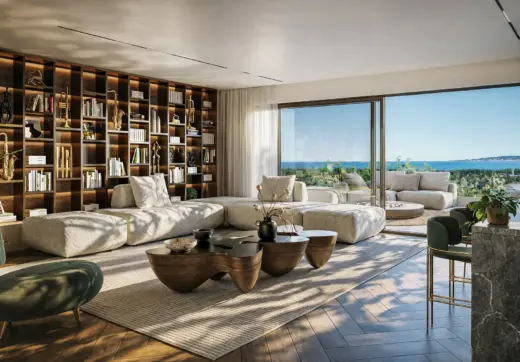 Elegant living room at Royal River Marbella with built-in library, large windows and open terrace sea view.
